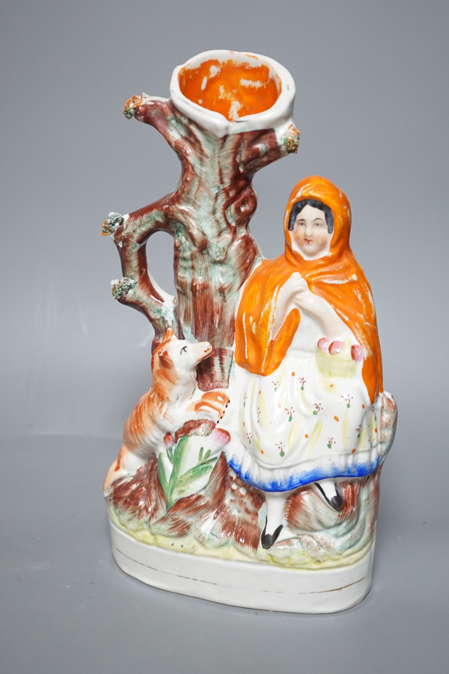A Wedgwood glazed black basalt bust of Shakespeare, two Victorian Staffordshire figures and a cow creamer, tallest 27cm